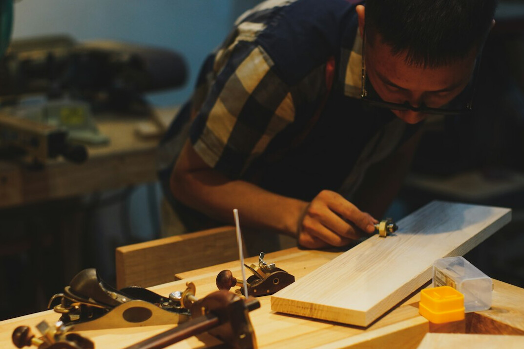 traditional carpenter at workbench