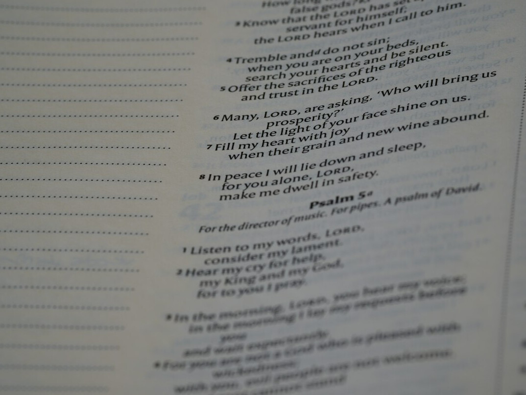 Notebook with handwritten inventory list and pen