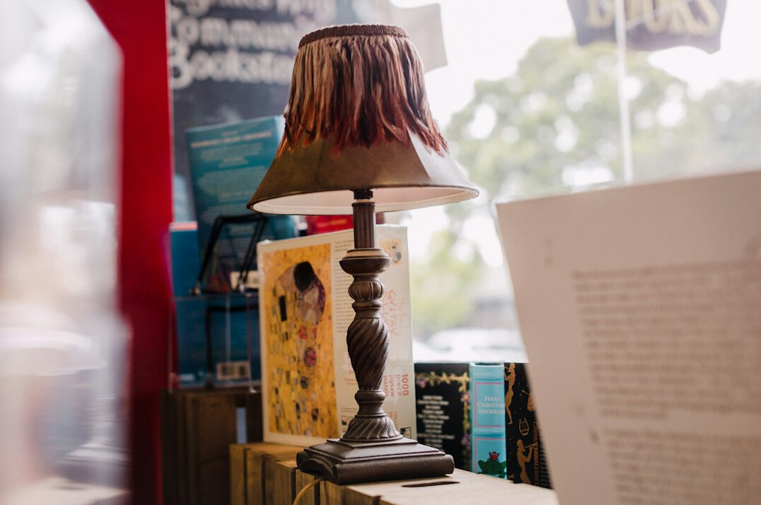 Wooden desk with books, lamp and a collector's catalogue