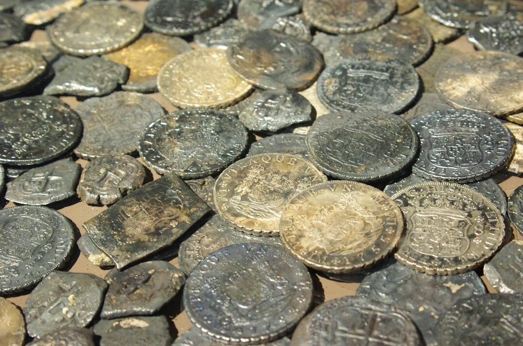 ancient roman coins on table
