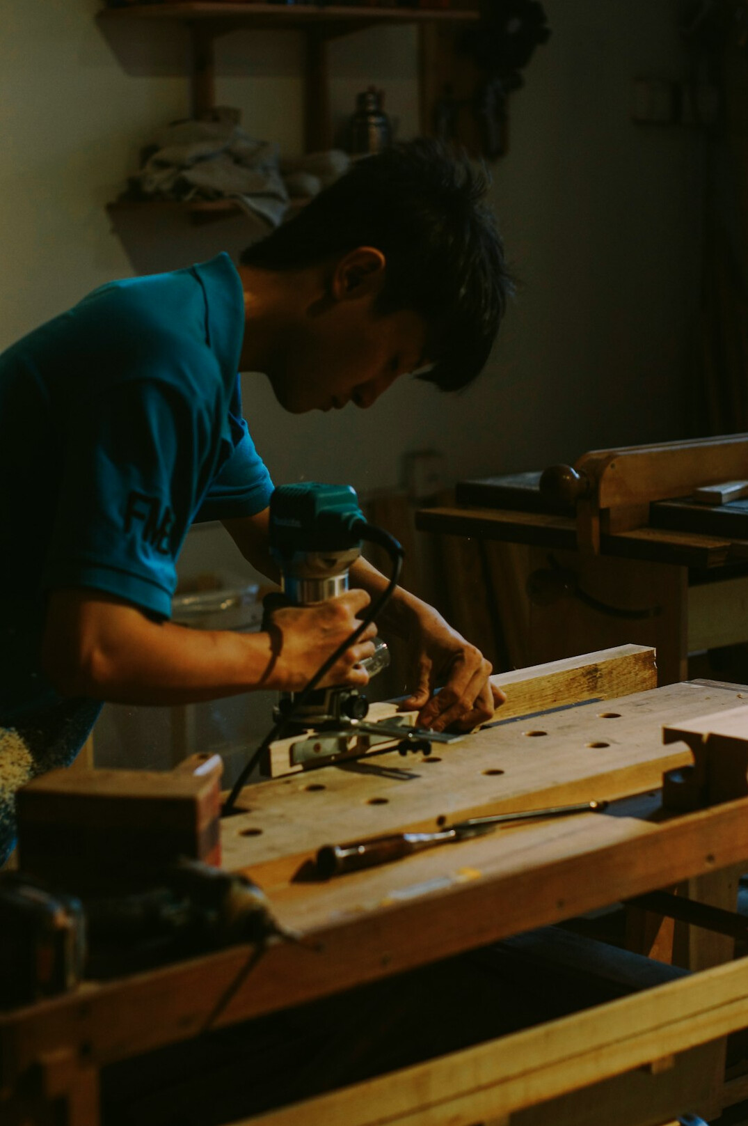 woodworker using hand plane