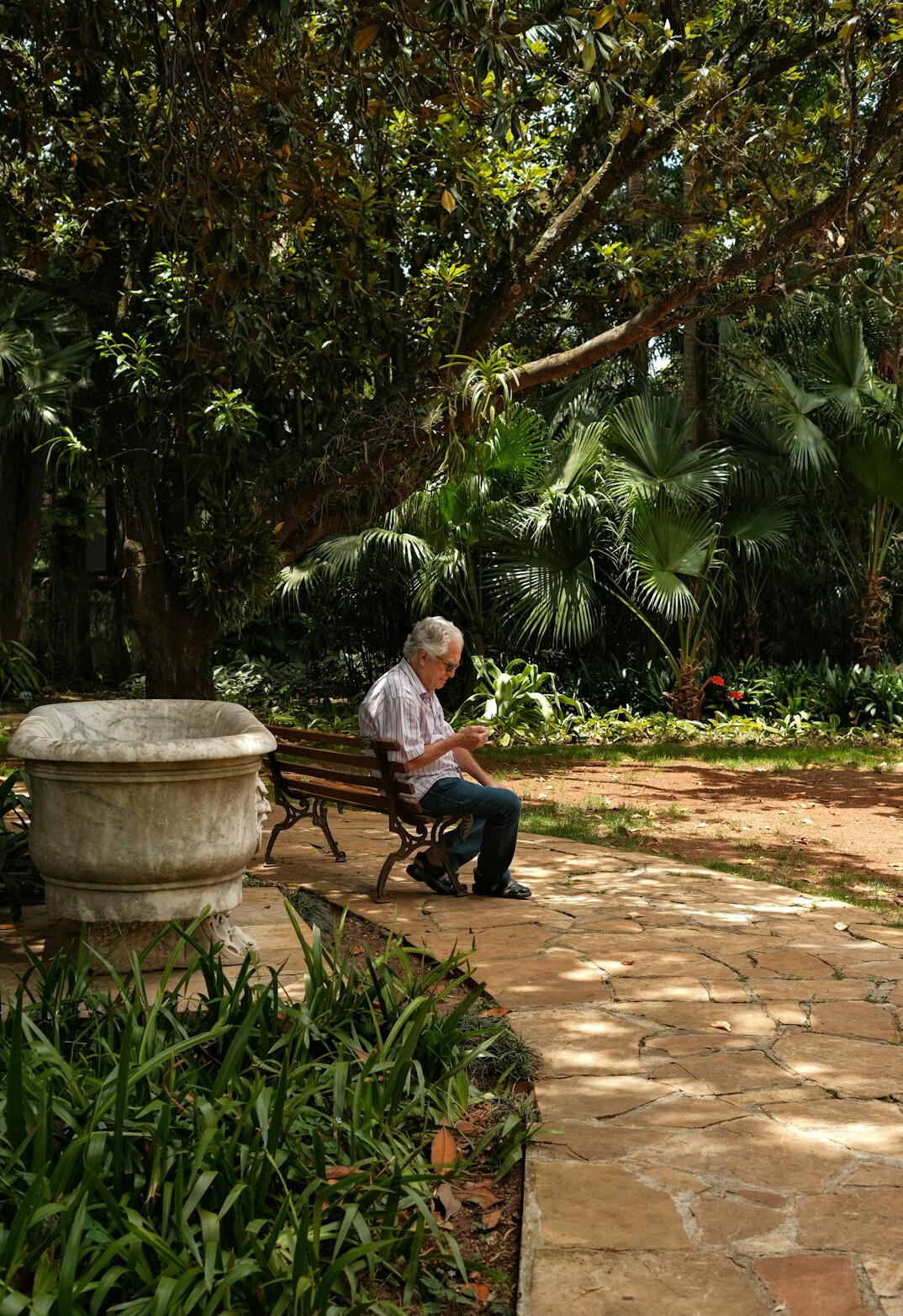 traditional gardener in lush garden