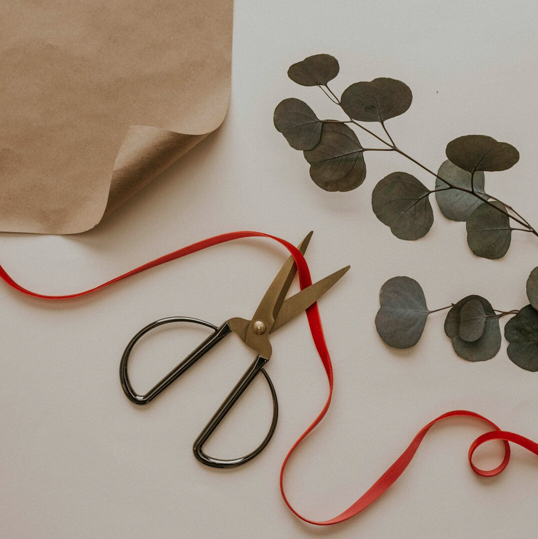 Craft supplies with paper, scissors and twine