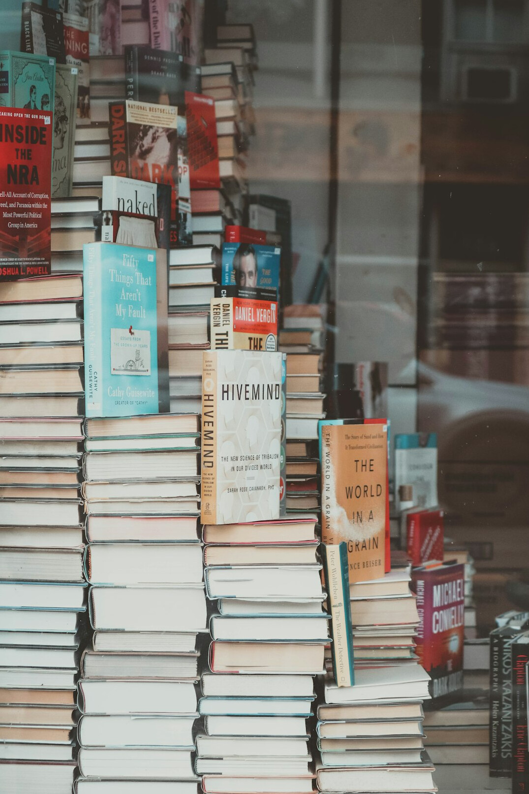 Stack of old hardcover books on a shelf